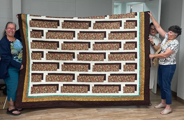A quilt being displayed ahead of the chef's got your back youth fundraiser.