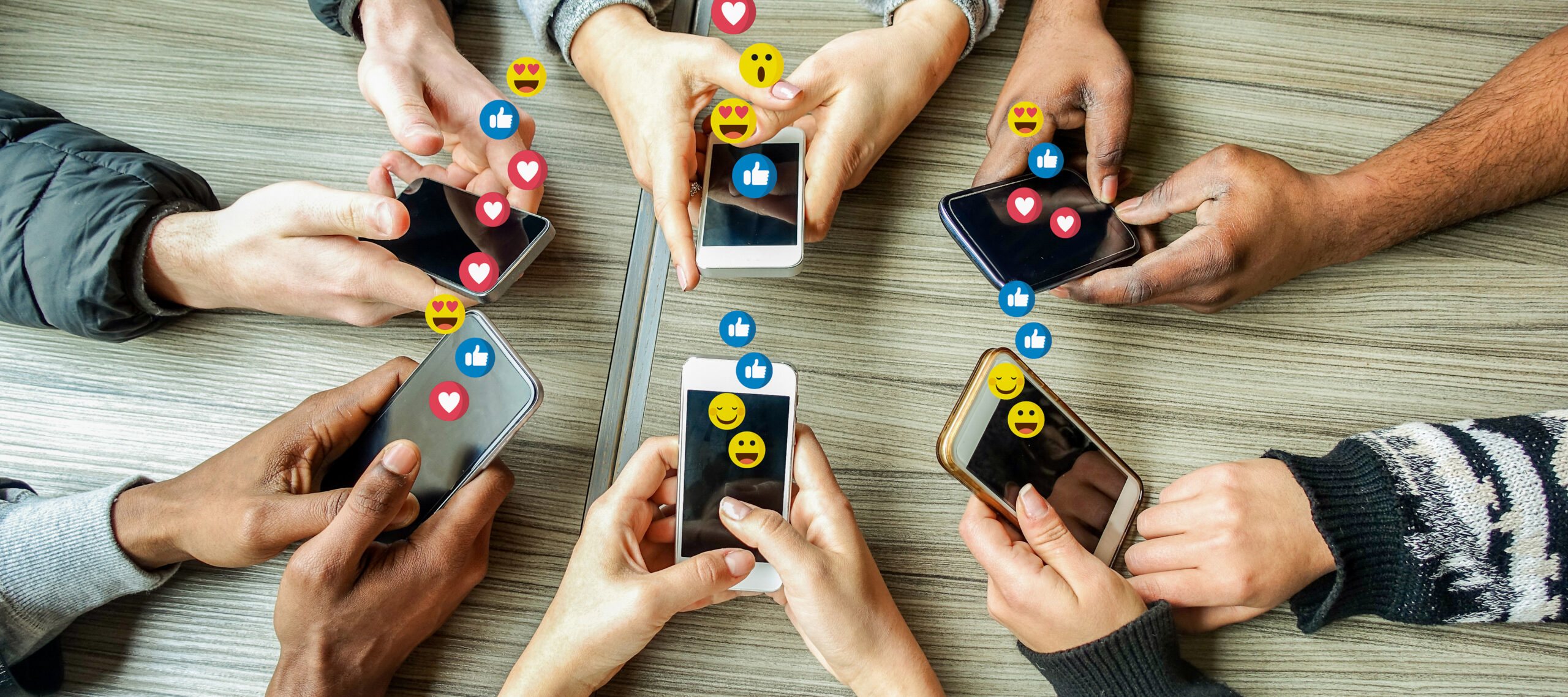 hands using phones with social media icons 2026 01 11 08 10 58 utc scaled